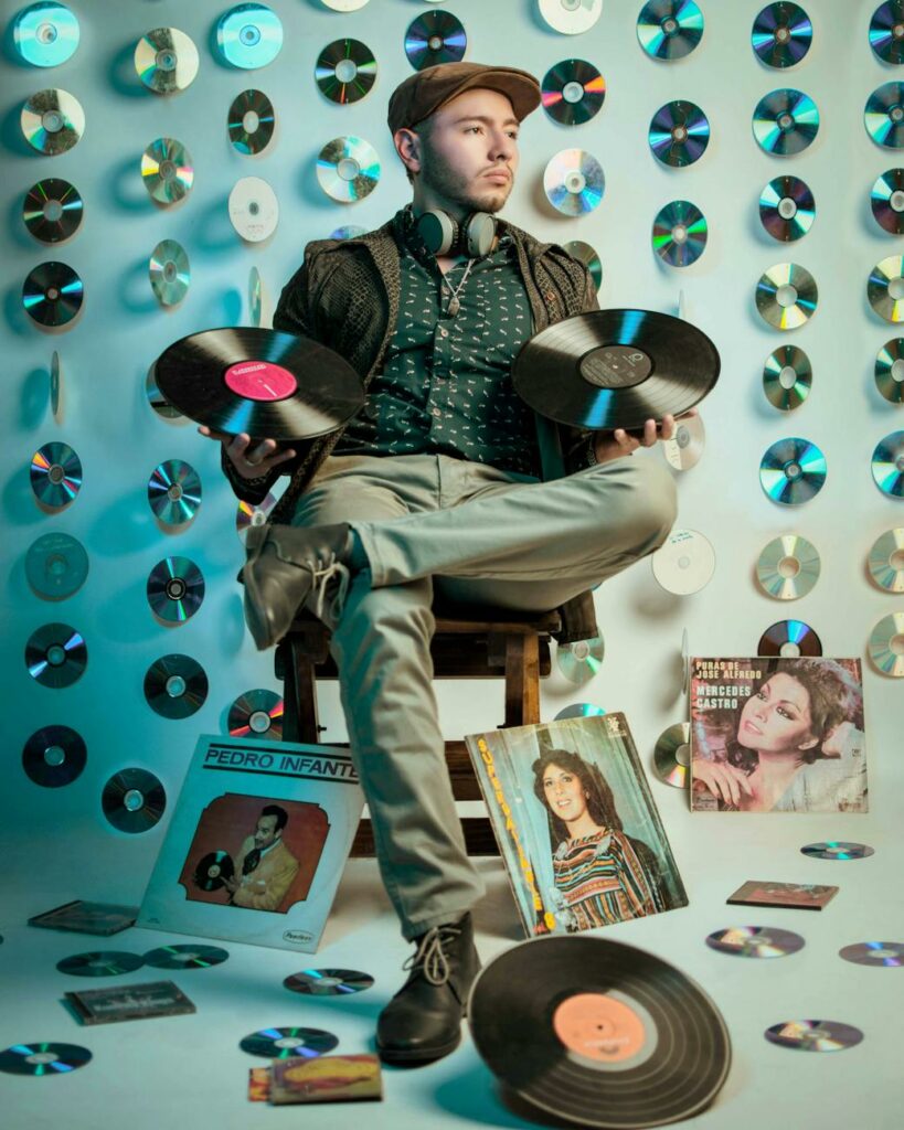 retro music enthusiast surrounded by vinyls
